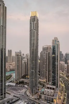 a city with tall skyscrapers in a city at 4BR - Burj and Fountain View - Opposite Dubai Mall in Dubai