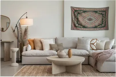 a living room with a couch and a table at 4BR - Burj and Fountain View - Opposite Dubai Mall in Dubai