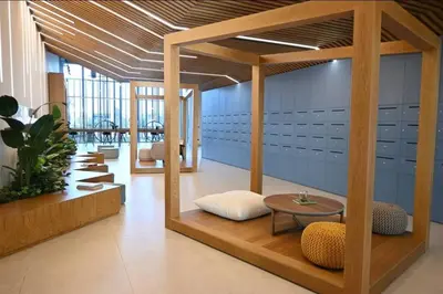 a room with a table and a bench and a table sidx sidx sidx at Dubai Hills Collective Tower 2 in Dubai