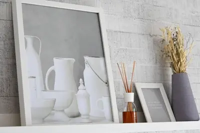 a mirror on a shelf with vases and other items at Dubai Hills Collective Tower 2 in Dubai