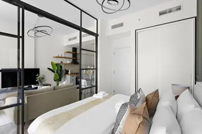 a bedroom with a large bed and a couch at Silkhaus Chic 1BDR in Exclusive Neighbourhood in Dubai
