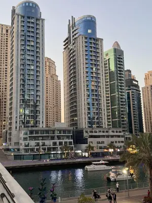 a city with tall buildings and a river at Luxury apartment 3 beds Marina view in Dubai