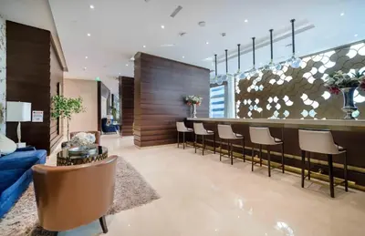 a lobby with a bar with a bunch of chairs at Apartment Dubai Marina, Damac Heights 804 in Dubai