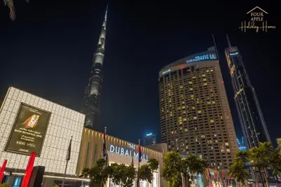 a view of the oriental pearl tower at night at Four Apple EMAAR Fashion Avenue Studio in Dubai