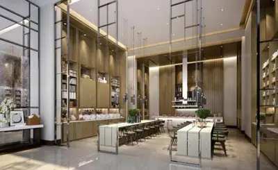 a lobby with tables and chairs in a building at The Address Fountain Views - Residence 2 Bedroom with Burj Khalifa view and access to Dubai mall in Dubai