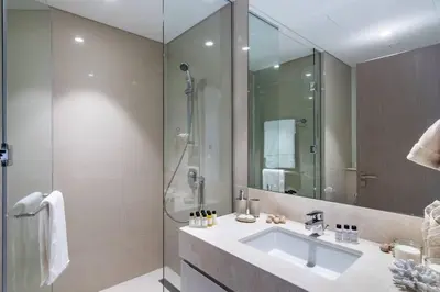 a bathroom with a sink and a shower at FIRST CLASS 2BR In the HEART of Downtown Dubai in Dubai