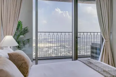 a bedroom with a bed and a large window at Trophy Live in the Sky Luxury Moon Collection Suites with DIFC Views 45Th Floor in Dubai