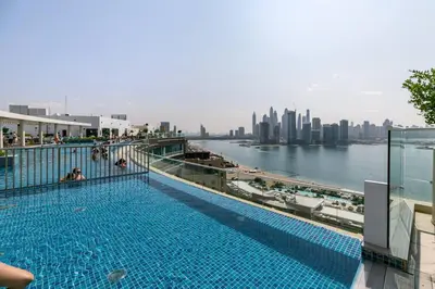 a swimming pool with a view of the city at Keysplease Studio W/Beach Access near Mall, Palm Jumeirah in Dubai