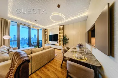 a living room with a couch and a table at Downtown Views I - Burj Khalifa View, Downtown Dubai in Dubai