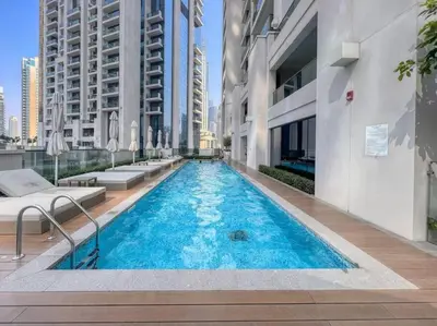 a swimming pool in the middle of a building at Burj Khalifa Views Stylish 2BR Near Dubai Mall and Metro in Dubai