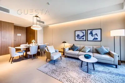 a living room with a couch and a table at Address Residences Dubai Opera - Burj Khalifa & Fountain View, Downtown Dubai in Dubai