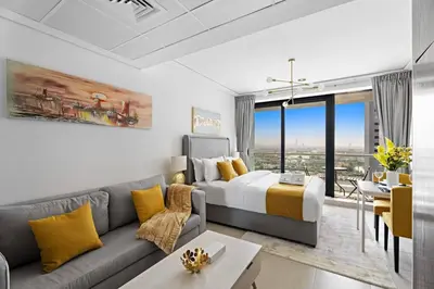 a living room with a bed and a couch at Newly Furnished Studio in JLT in Dubai