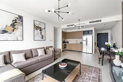 a living room with a couch and a table at Luxurious 2 BR in Downtown Dubai in Dubai