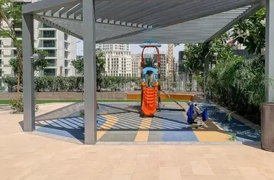 a park with a playground with a swing at Luxury 1BR Retreat l 17 Icon Bay, Dubai Creek in Dubai