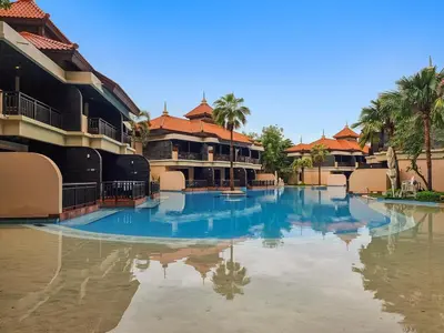 a large swimming pool in the middle of a resort at Full Sea View 1 BR with Lagoon Pool & Beach Access in Dubai