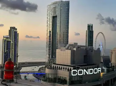 a view of a city skyline with a tall building at Lux 1BR w rooftop pool in Marina near metro, Beach in Dubai