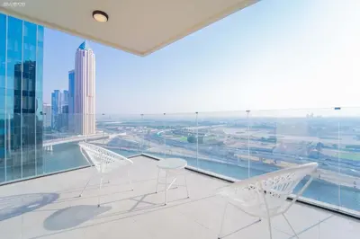 a room with chairs and a view of the city at Fabulous Missoni Designer Building, 3 bedroom plus maid in Dubai