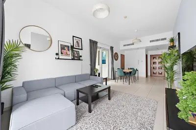 a living room with a couch and a table at Splendid 1BR APT in Dubai Marina in Dubai
