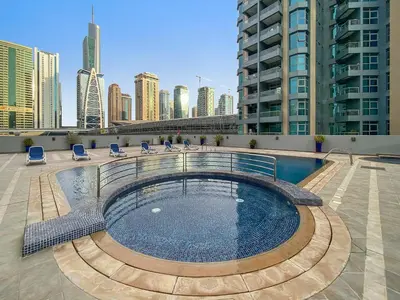 a swimming pool on the roof of a building at Splendid 1BR APT in Dubai Marina in Dubai