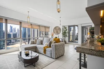 a living room with a couch and a table at Skyline Retreat - South Ridge 2 - Downtown Dubai in Dubai