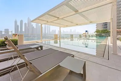 an outdoor patio with a view of the city at Silkhaus Sea & City View 1BDR in Exclusive Neighbourhood in Dubai