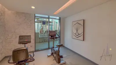 a room with two exercise machines and a window at Sky-High 1BR RetreatMarina VistaEmaar Beachfront in Dubai