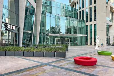 a large building with a red bowl in front of it at Downtown 3BR Sleeps 9 Balcony, Full Kitchen, Near Metro in Dubai