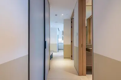 a hallway in a house with glass doors at Address JBR 2 Bedroom With Beach Access by Millennium Vacation Homes in Dubai