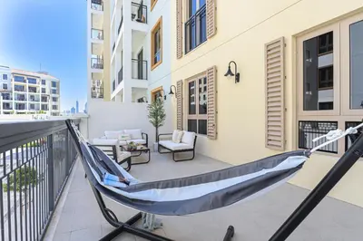 a hammock on the balcony of a apartment at HiGuests - Luxurious Boho Beach 2BR Apartment in La Mer in Dubai
