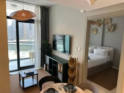 a hotel room with a bedroom with a bed and a window at 1BR Apartment in Zada Tower Business Bay - Close to Metro in Dubai