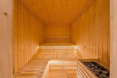 a sauna with wooden walls and a wooden floor at 1BR Apartment in Zada Tower Business Bay - Close to Metro in Dubai