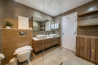 a bathroom with a toilet and a sink at Top-Floor Luxury 2BR with Stunning Marina View in Dubai