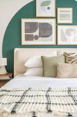 a bedroom with a white bed with pictures on the wall at GuestReady - A Dream Getaway at Business Bay in Dubai