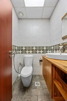a bathroom with a toilet and a sink at Prime Spacious 5 plus 1 BR Apt on JBR Beach near Metro ,Walk to The Mall, Dining & Entertainment - By Sunkissed Holiday Homes in Dubai