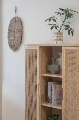 a book shelf with a potted plant on top of it at DAYF-SOL Luxury Living in Business Bay in Dubai