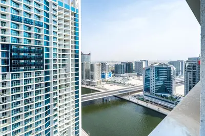a view of a river in a city with tall buildings at Studio Apartment in DAMAC Maison Prive Businessbay - Dubai Canal View in Dubai