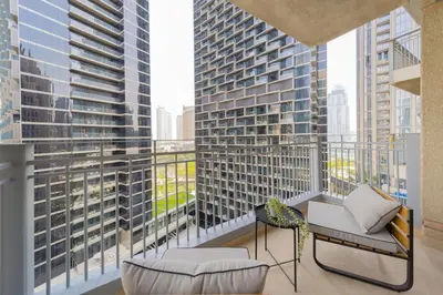 a balcony with a view of a large building at EDEN'S Homes & Villas - Standpoint Residences in Dubai