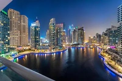 a view of a city skyline at night at FIRST CLASS 2BR with Exquisite Full Marina View in Dubai