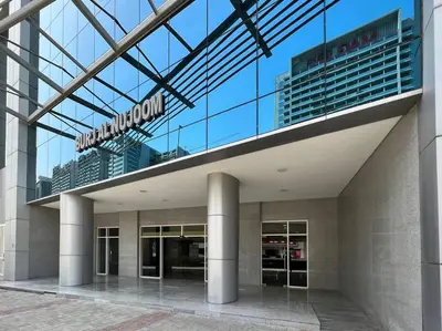 a building with a sign on top of it at Stylish Studio Walk to Dubai Mall & Burj Khalifa with Pool, Gym & Balcony in Dubai