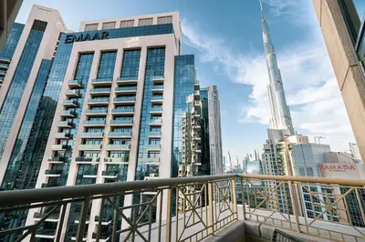 a view of the shard from a balcony in a city at The Signature Burj Khalifa View Residence with Terrace in Dubai