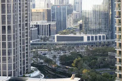 an aerial view of a city with tall buildings at The Signature Burj Khalifa View Residence with Terrace in Dubai