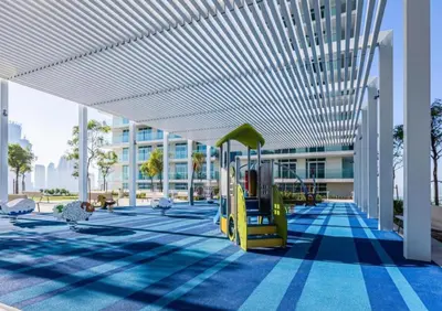 a playground with a slide in a building at Marina Skyline View & Dubai Harbour Beachfront in Dubai