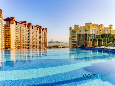 a large swimming pool on top of a building at Elegant 1BR in Palm Tower, Nakheel Mall, Sea View in Dubai
