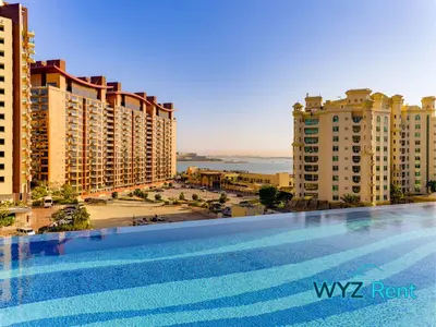 a large swimming pool in front of some buildings at Palm Tower Luxury Studio W Stunning Sea View in Dubai