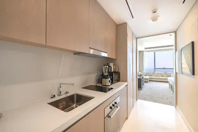a kitchen with a sink and a counter top at Palm Tower Luxury Studio W Stunning Sea View in Dubai