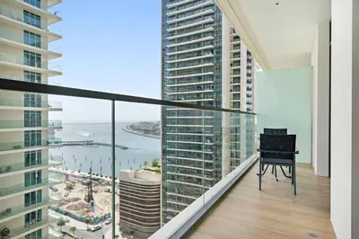 a balcony with a view of the ocean at Silkhaus Sea and City View 1BDR in Marina Vista in Dubai