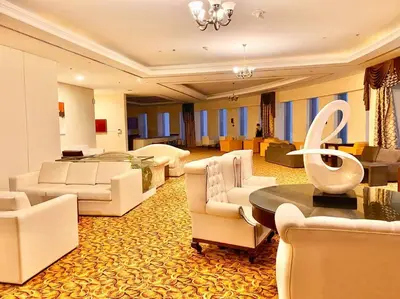 a large living room with couches and a table and chairs at Your Scenic Dream Vacation in Dubai
