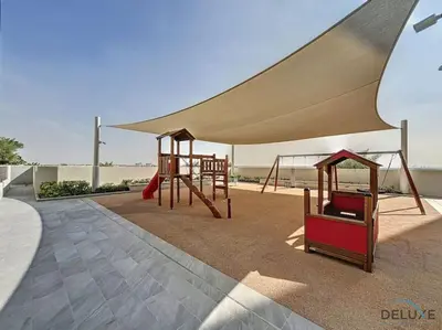 a playground with a tent and a swing at Lavish 1BR Apartment at Summer at Creek Beach, Dubai Creek Harbor by Deluxe Holiday Homes in Dubai