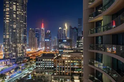 a view of a city skyline at night at FIRST CLASS 1BR Beautifully Furnished in Dubai