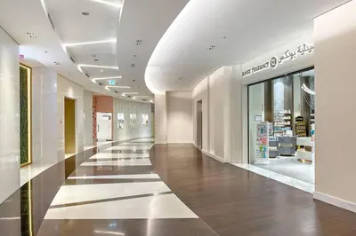a hallway in a shopping mall with a store at FIRST CLASS 1BR Beautifully Furnished in Dubai
